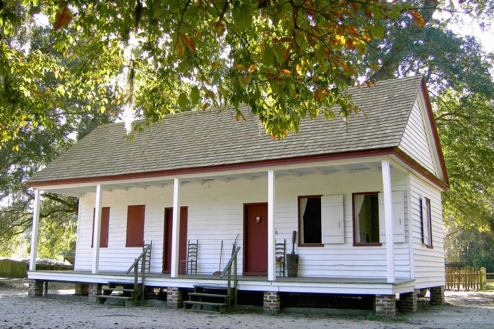 a tree in front of a house with Thomas Alva Edison Birthplace in the background